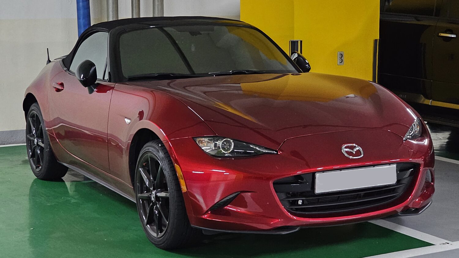 Red Mazda MX-5 Miata roadster, front three-quarter