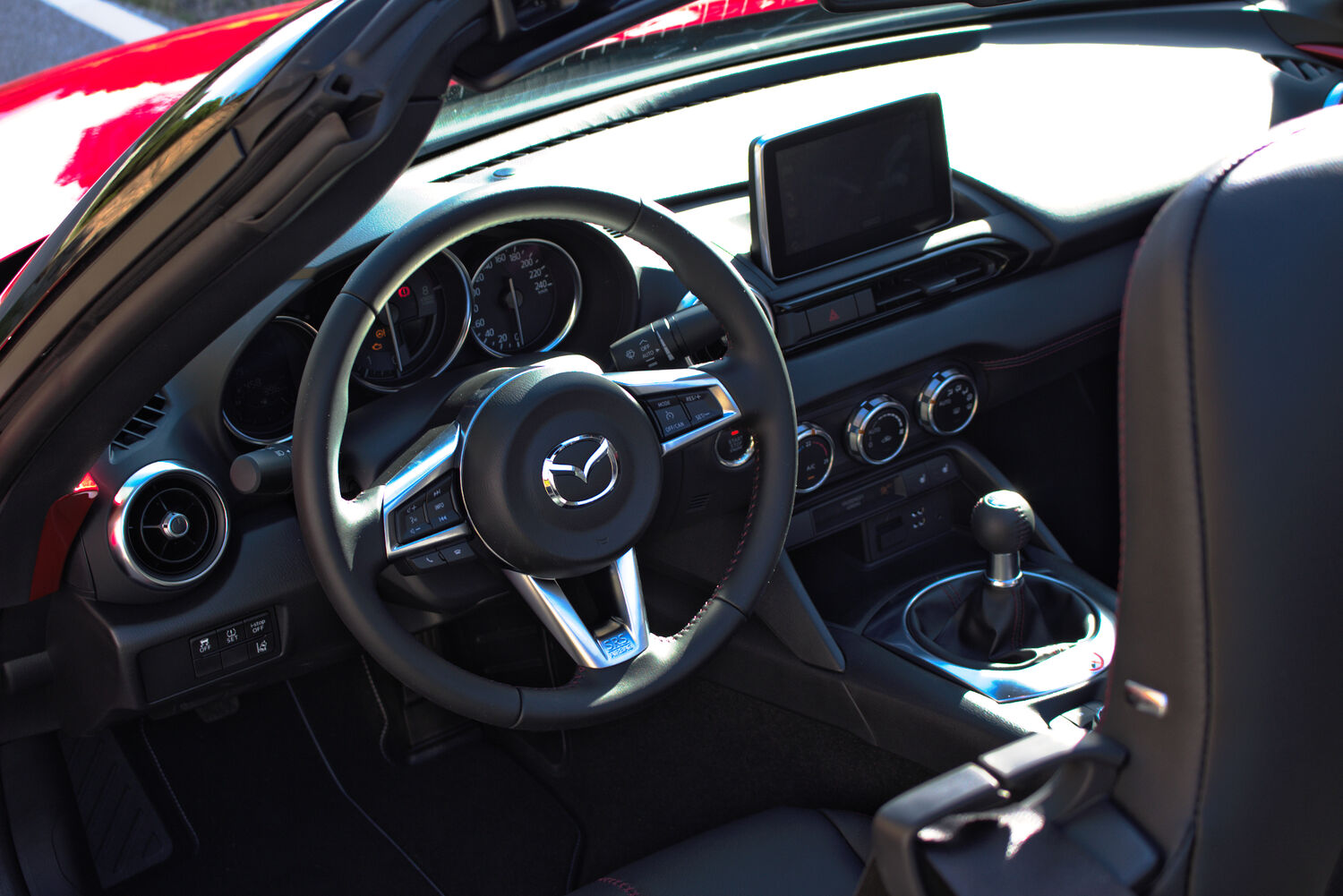 Mazda dashboard with the Gen 6 Mazda Connect touchscreen above the center stack
