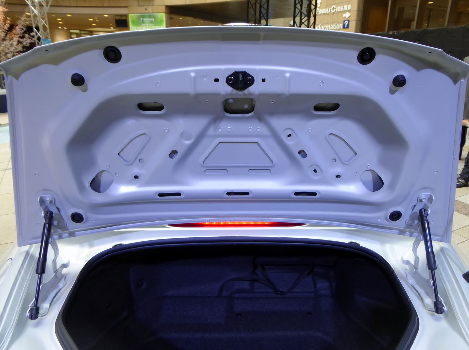 ND Mazda Roadster trunk with the lid raised, showing the opening, weatherstrip, and lid supports