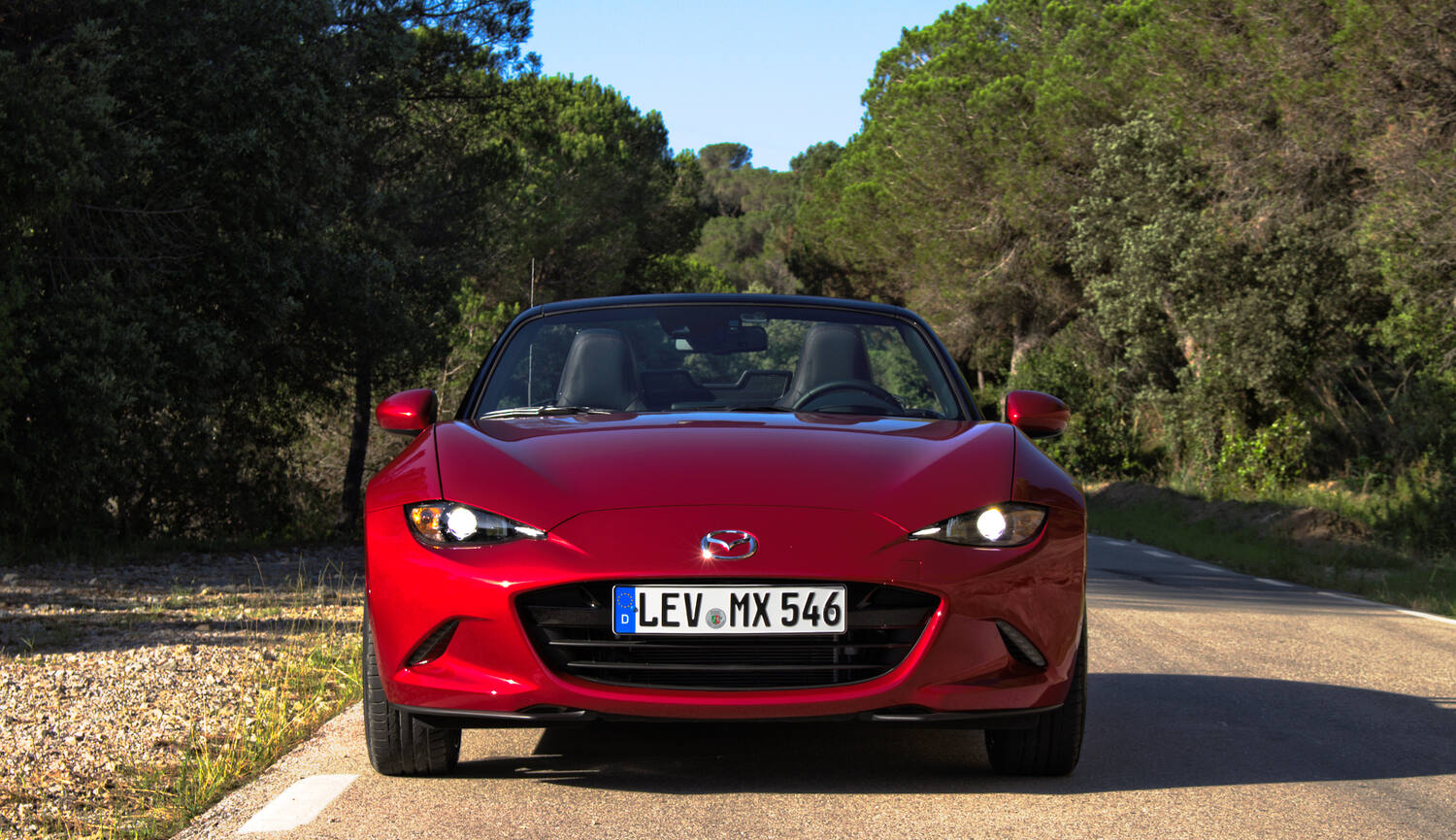 2016-2023 Mazda MX-5 dead-on front view showing the original LED headlight and DRL signature